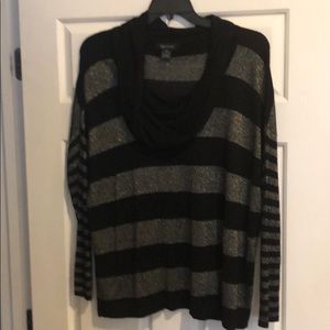 Long silver metallic and black cowl neck sweater.